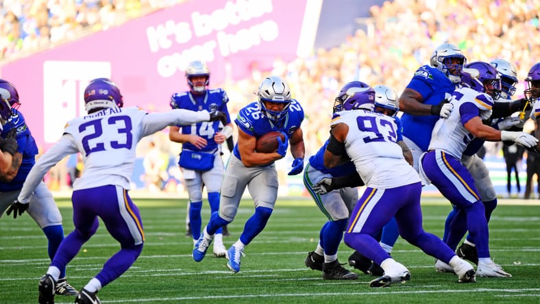 Zach Charbonnet runs the ball against the Vikings in Seattle.