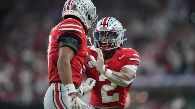 Caleb Downs and Lorenzo Styles Jr. react during Big Ten title game.