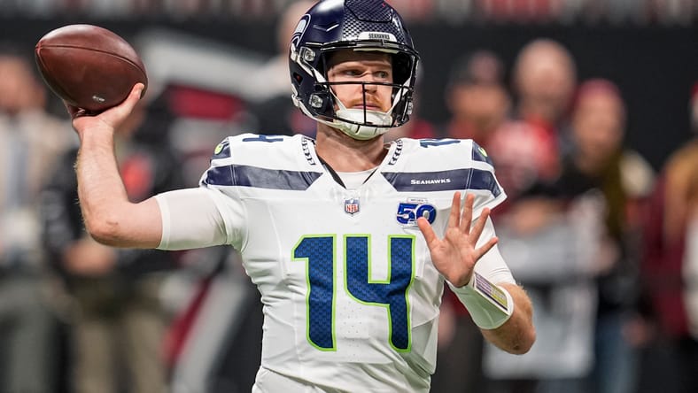 Sam Darnold warms up before the game against Atlanta.