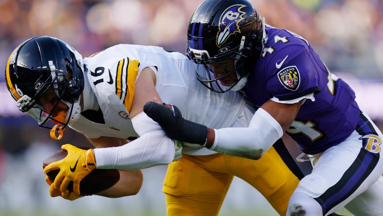 Adam Thielen hauls in a pass against Marlon Humphrey.