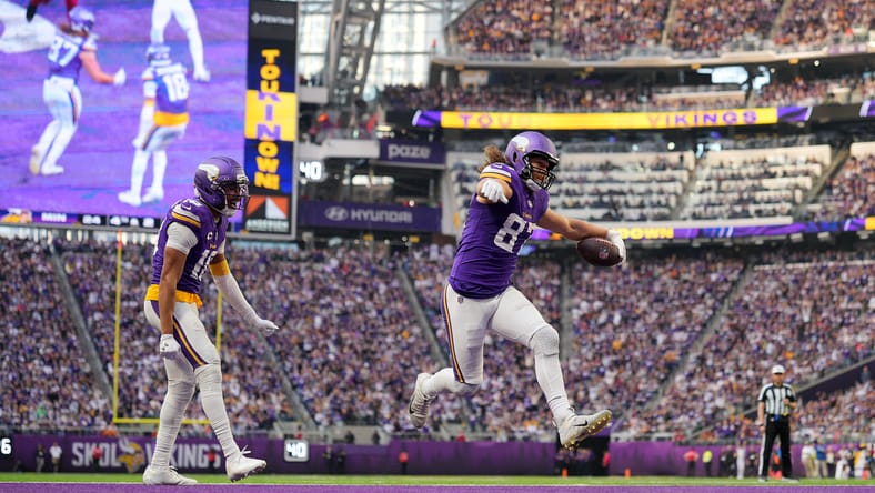 Vikings TE T.J. Hockenson celebrates a touchdown versus Washington.