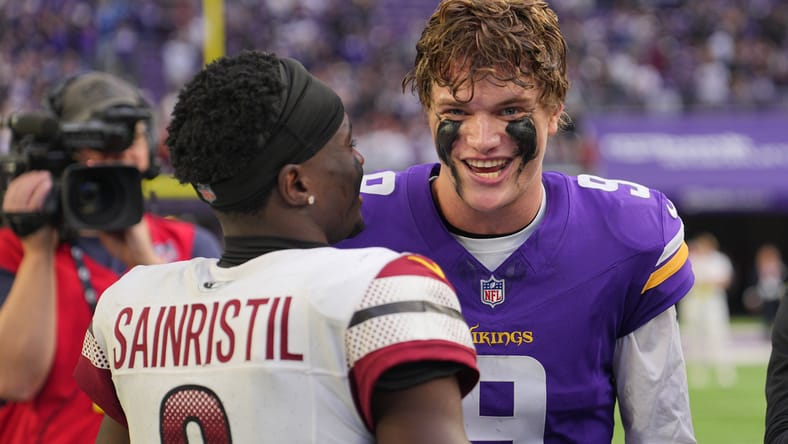 J.J. McCarthy and Mike Sainristil talk after the game.