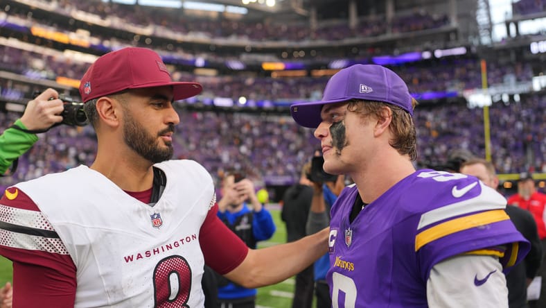 J.J. McCarthy and Marcus Mariota share postgame exchange.