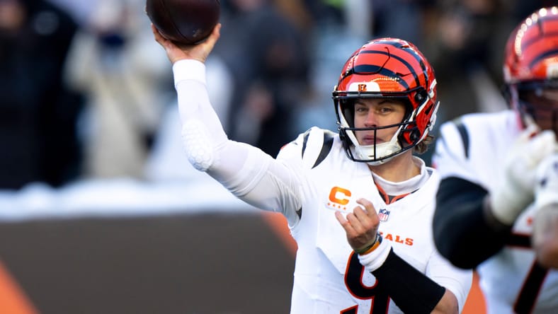 Joe Burrow throws a pass under pressure against the Ravens.