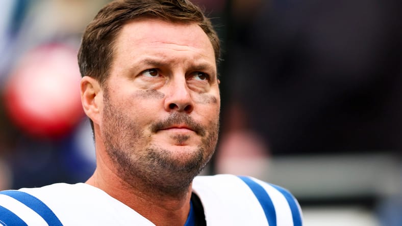 Colts quarterback Philip Rivers walks toward the locker room at Lumen Field
