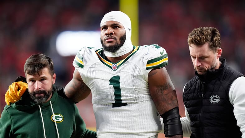 Micah Parsons is helped off the field by medical staff after an injury against the Broncos. Micah Parsons injury.