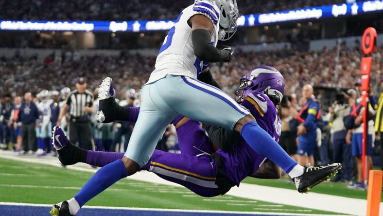 Jalen Nailor catches a touchdown pass over Cowboys cornerback Daron Bland during the first half at AT&T Stadium.