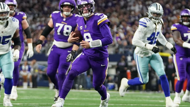 J.J. McCarthy scrambles during the first half against the Cowboys at AT&T Stadium.