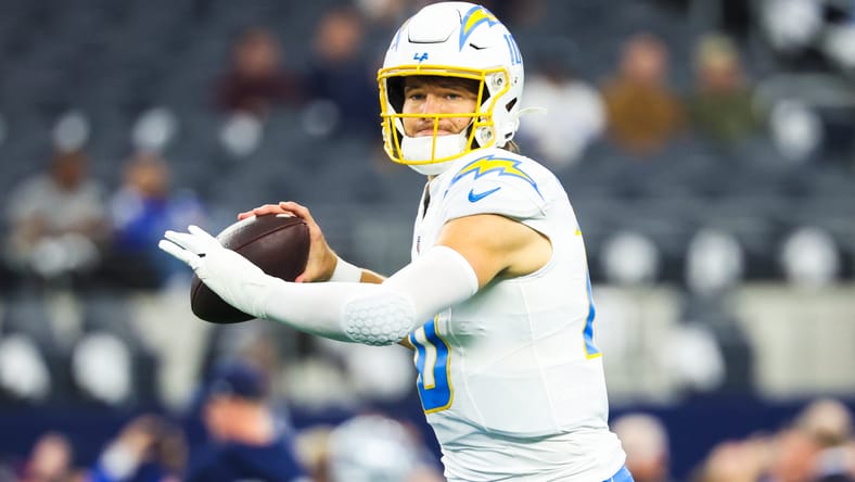 Justin Herbert throws passes during pregame warmups at AT&T Stadium before facing the Cowboys. Justin Herbert trade rumors,
