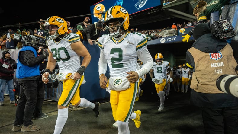 Malik Willis takes the field before a Packers game at Soldier Field. Malik Willis Vikings.