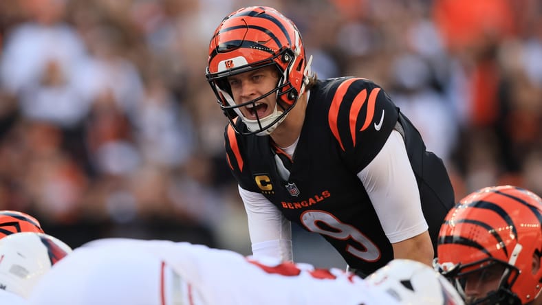 Joe Burrow calls signals at the line of scrimmage during Bengals vs. Cardinals game. Joe Burrow trade rumors.