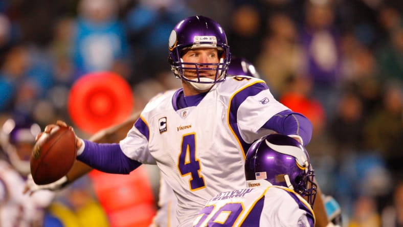Brett Favre looks to pass against the Panthers in Charlotte.