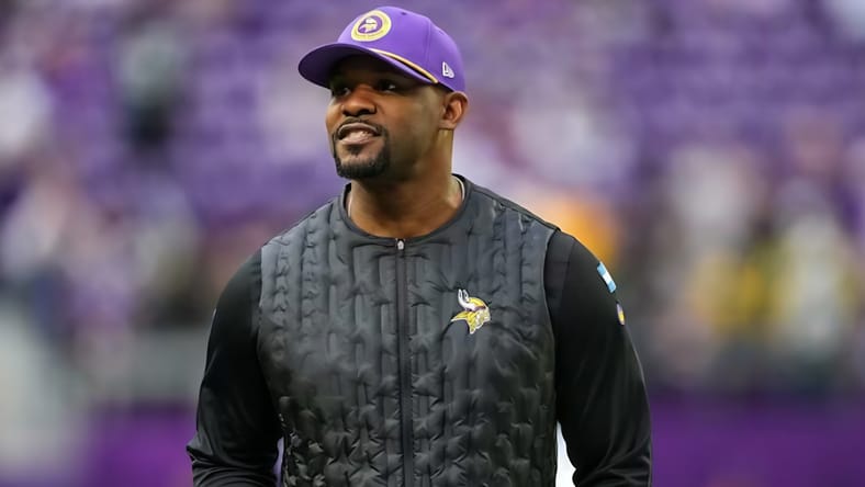 Brian Flores surveys the field before kickoff at U.S. Bank Stadium.