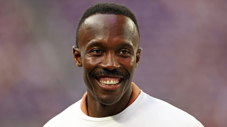 Vikings general manager Kwesi Adofo-Mensah stands on the sideline during pregame warmups at U.S. Bank Stadium.