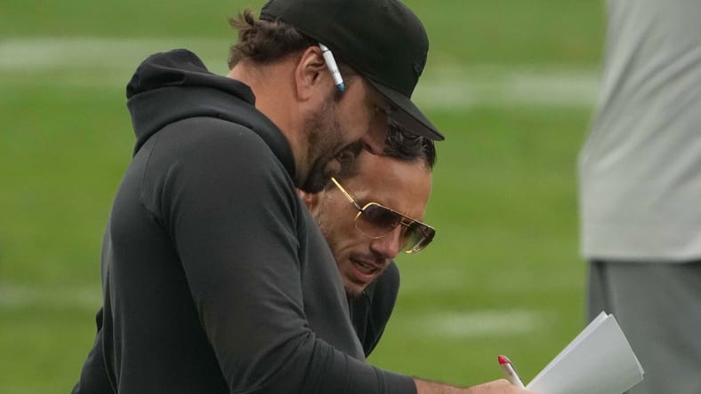 Frank Smith and Mike McDaniel observe practice at PSD Bank Arena in Frankfurt. Vikings offseason secrets