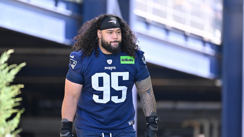Patriots defensive tackle Khyiris Tonga walking to the practice field during training camp.