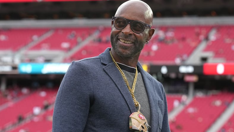 Jerry Rice on the field at Levi’s Stadium before a 49ers game. Justin Jefferson GOAT endorsement.