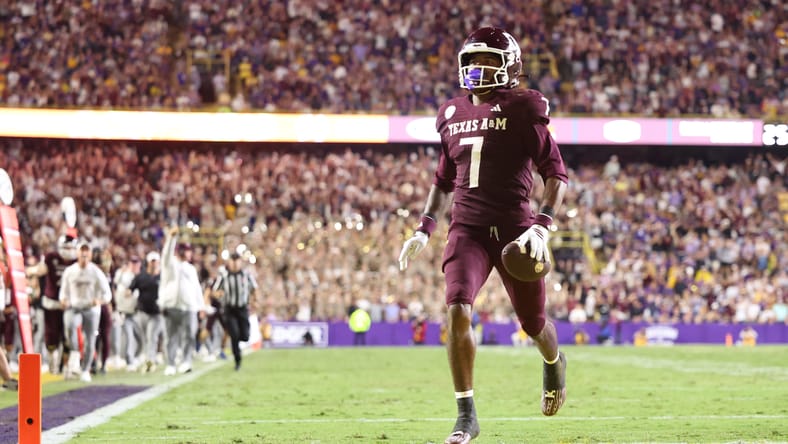 KC Concepcion returning a punt for a touchdown at Tiger Stadium. Vikings mock draft WR KC Concepcion.