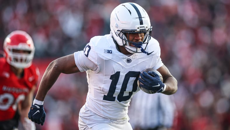 Penn State running back Nicholas Singleton carries the ball against Rutgers at SHI Stadium.