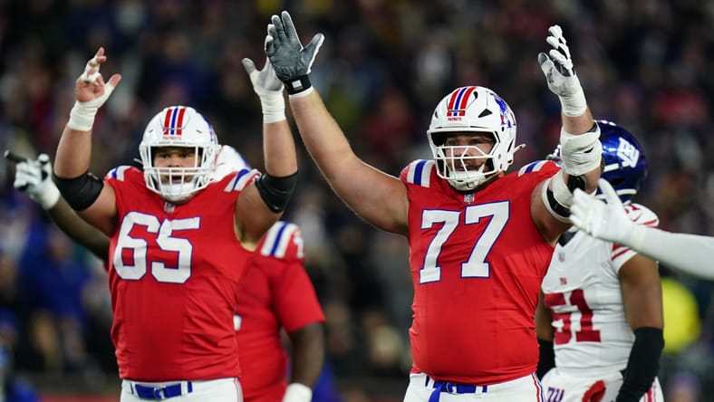 Patriots centers Garrett Bradbury and Ben Brown celebrate during a second-quarter play. former Vikings in Super Bowl.