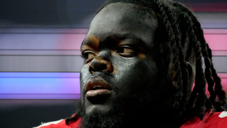 Kayden McDonald on the field before the Big Ten Championship.