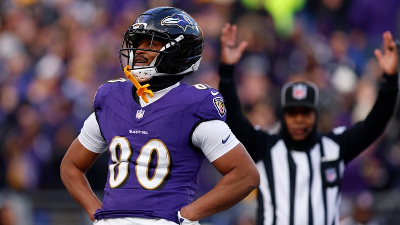 Isaiah Likely celebrates after a touchdown for the Ravens.