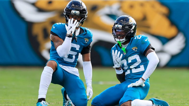 Jaguars cornerbacks Greg Newsome II and Jarrian Jones celebrating after a pass breakup. Vikings free agency cornerbacks.