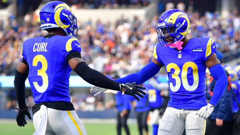 Rams defenders Kam Curl and Josh Wallace high-five during a second-quarter play at SoFi Stadium.