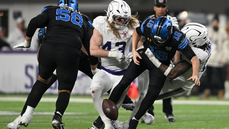 Vikings defenders force a Jared Goff fumble during a fourth-quarter play against the Lions at U.S. Bank Stadium.