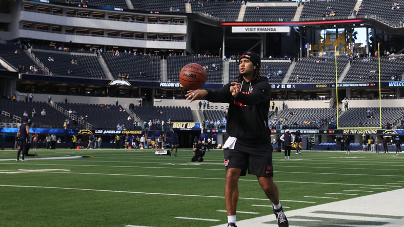 C.J. Stroud warms up with a basketball before a game at SoFi Stadium.