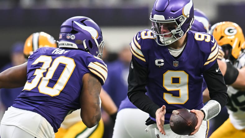 J.J. McCarthy hands the ball off during the first quarter at U.S. Bank Stadium. what we learned Vikings Packers.
