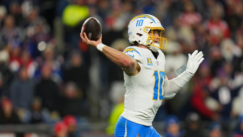 Justin Herbert throws a pass against the Patriots at Gillette Stadium. Justin Herbert Vikings trade.