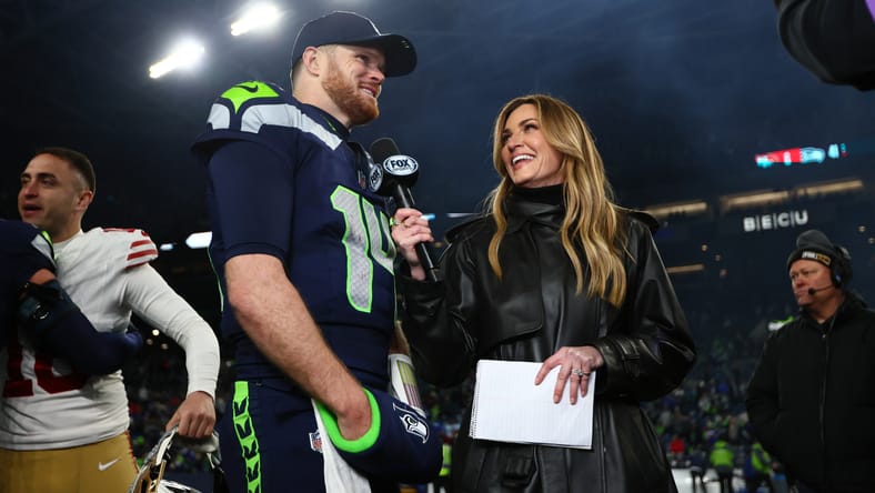 Sam Darnold speaks with Erin Andrews after a Seahawks playoff game at Lumen Field.