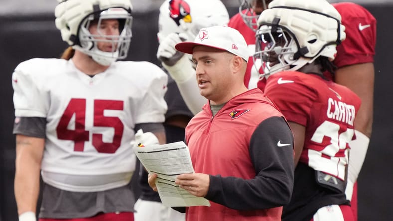 Drew Petzing speaks to Cardinals players during training camp. Drew Petzing Lions offensive coordinator.