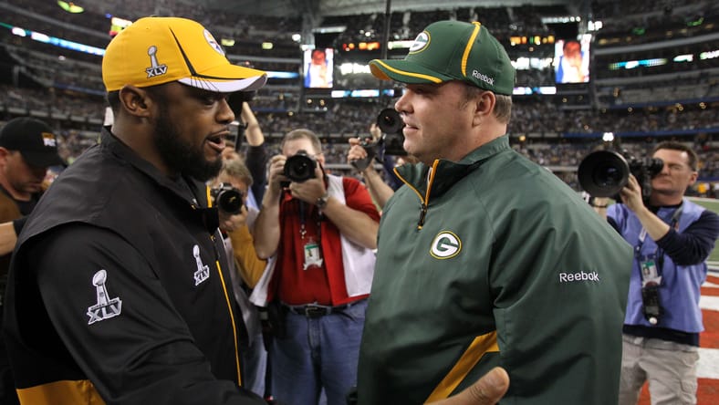 Mike McCarthy greeting Mike Tomlin before Super Bowl XLV