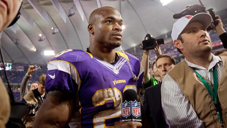 Adrian Peterson stands on the field after a win over the Packers at the Metrodome.