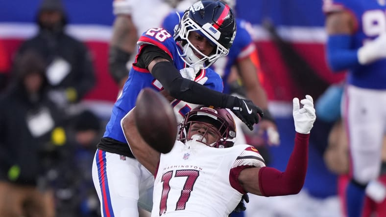 Cor’Dale Flott defends a pass against Terry McLaurin.