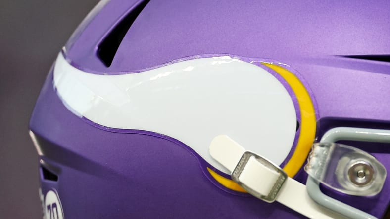 Vikings quarterback J.J. McCarthy (helmet) takes the field before a home game at U.S. Bank Stadium.