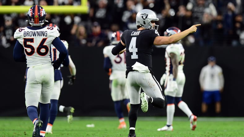 Derek Carr celebrates during a 2021 Raiders game against the Denver Broncos.