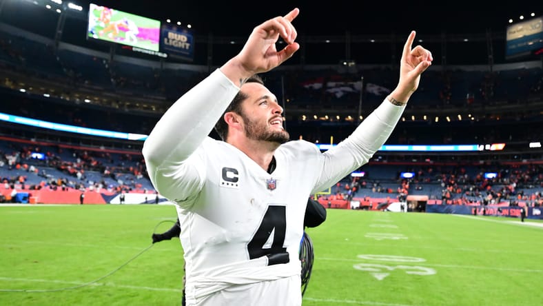 Derek Carr celebrates after the Raiders defeat the Broncos in overtime at Empower Field at Mile High.