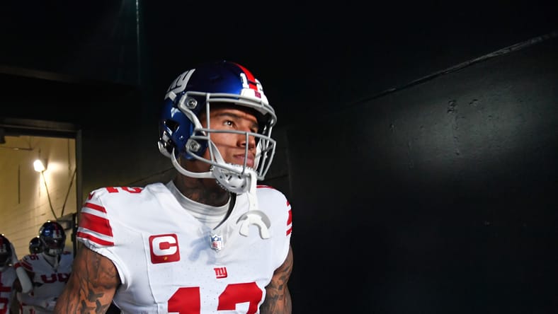 Darren Waller stands in the stadium tunnel before a New York Giants game.