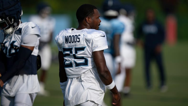 Xavier Woods stretches during Tennessee Titans training camp practice.