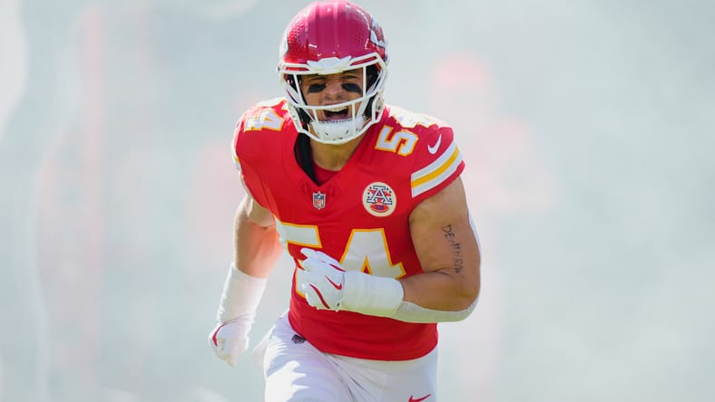 Leo Chenal runs onto the field during Chiefs pregame introductions at Arrowhead Stadium.
