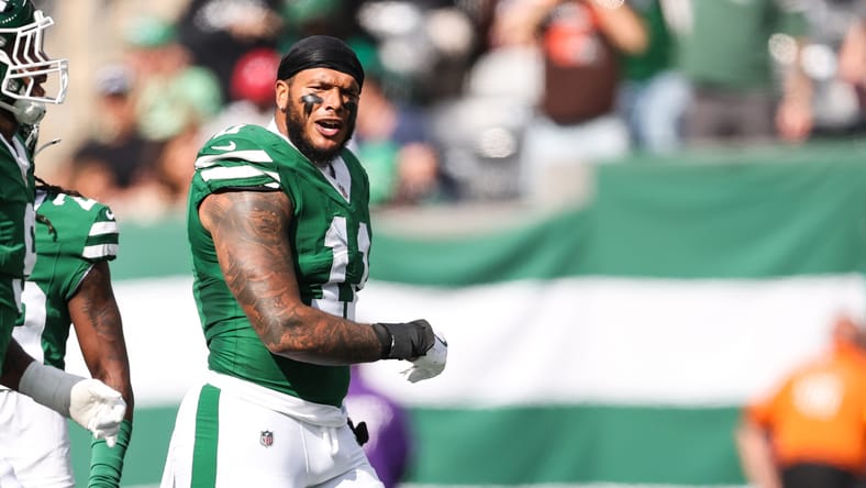 Jermaine Johnson celebrates a defensive play during a Jets home game.