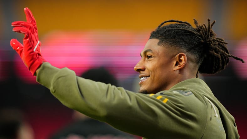 Isiah Pacheco waves to fans during Chiefs warmups at Arrowhead Stadium. Tyler Conklin Lions