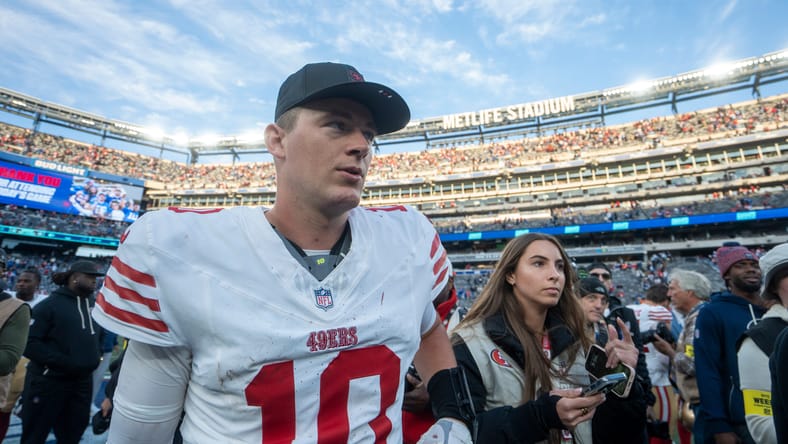 Mac Jones walks off the field after a 49ers road game against the Giants at MetLife Stadium.