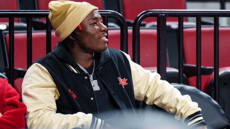 Emmett Johnson watches from the sideline during a Nebraska game at Pinnacle Bank Arena