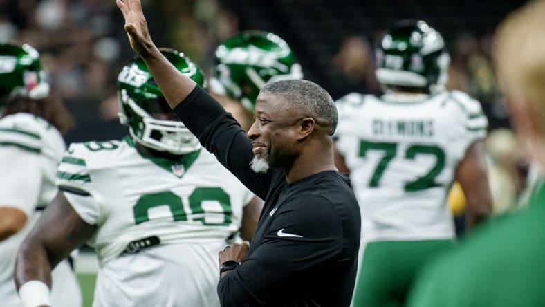 Aaron Glenn stands on the sideline before a Jets game in New Orleans.