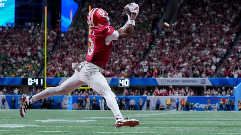 Omar Cooper Jr. catching a touchdown pass during the Peach Bowl at Mercedes-Benz Stadium. Vikings WR3 2026.