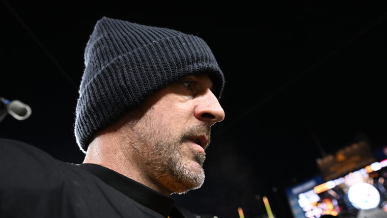 Aaron Rodgers leaving the field after a Steelers playoff loss to the Texans. Aaron Rodgers Vikings rumor.